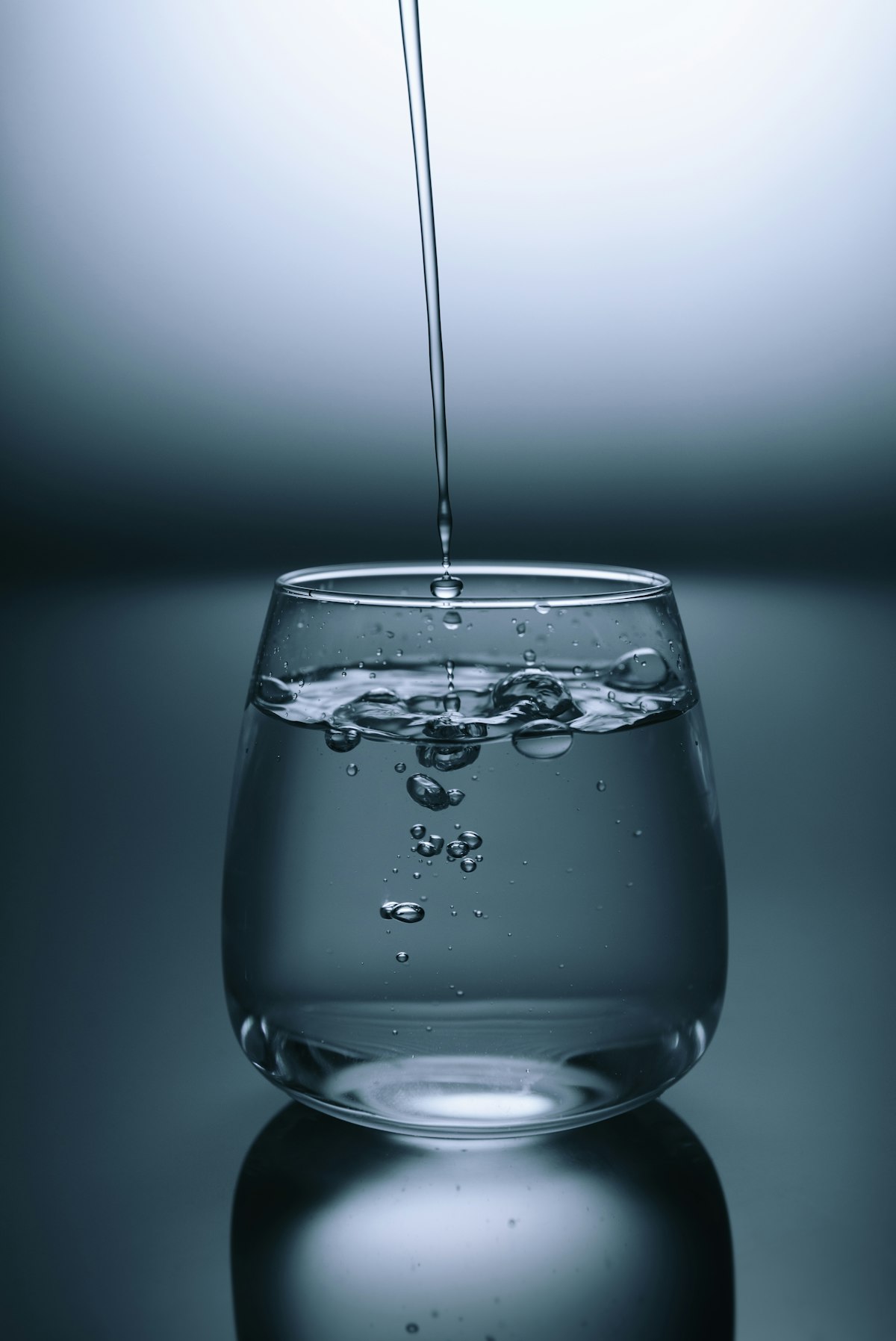 Clear drinking glass filled with water